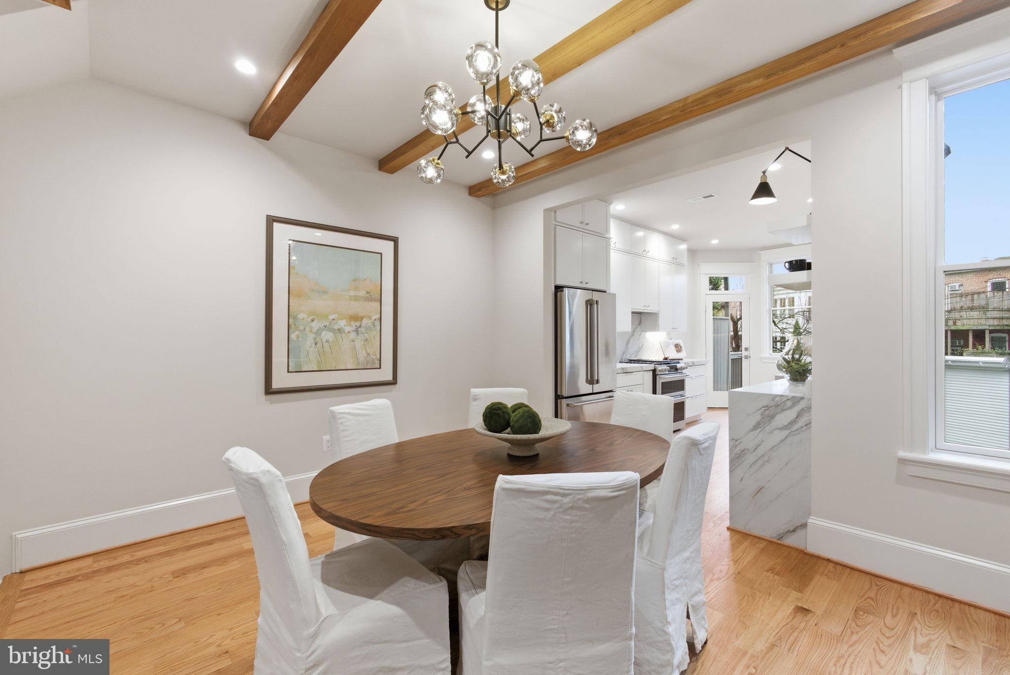 1319 East Capitol Street Southeast Washington, DC 20003 - Photo 10 of 46 a view of a dining room with furniture and wooden floor
