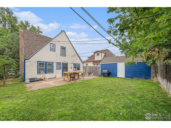 a house view with a sitting space and garden