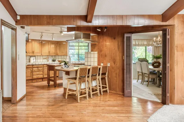 a kitchen with a stove a sink and a refrigerator