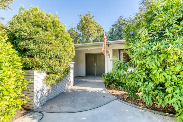 a view of a living room with a fireplace