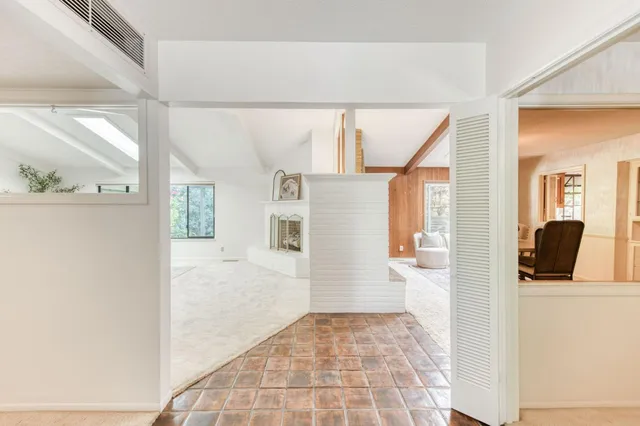a view of a dining room with furniture wooden floor and chandelier
