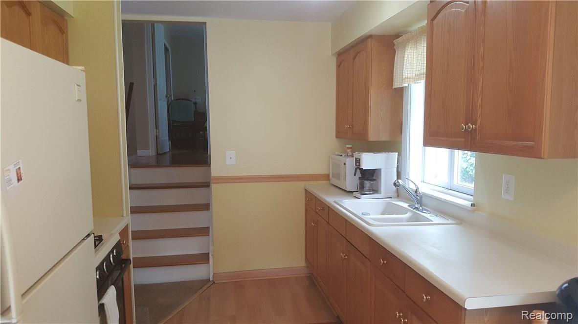 15719 Springhill Street Romulus, MI 48174 - Photo 11 of 20 View of kitchen from dining area.