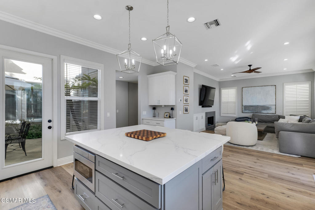 6140 Deerhill Road Oak Park, CA 91377 - Photo 13 of 72 a large kitchen with kitchen island a large island in it