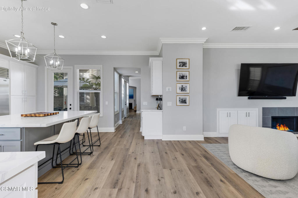 6140 Deerhill Road Oak Park, CA 91377 - Photo 16 of 72 a living room with furniture and a flat screen tv