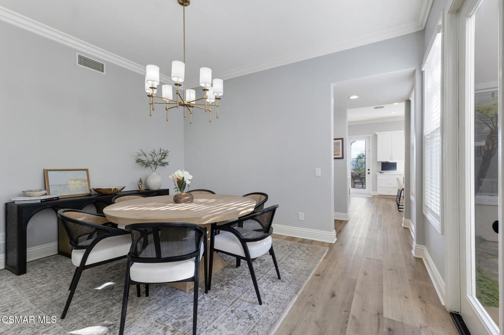 6140 Deerhill Road Oak Park, CA 91377 - Photo 17 of 72 a view of a dining room with a table and chairs