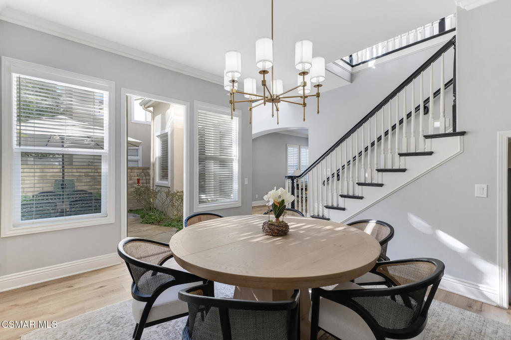 6140 Deerhill Road Oak Park, CA 91377 - Photo 18 of 72 a view of a dining room with furniture window and wooden floor
