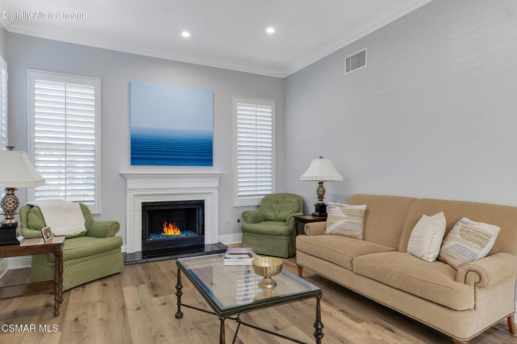 6140 Deerhill Road Oak Park, CA 91377 - Photo 20 of 72 a living room with furniture and a fireplace