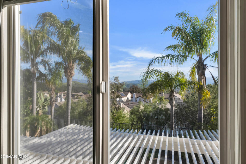6140 Deerhill Road Oak Park, CA 91377 - Photo 23 of 72 a view of a balcony with a tree