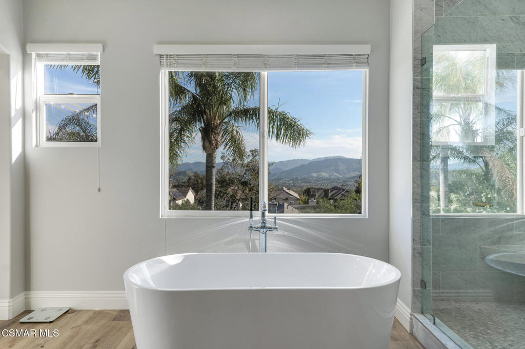 6140 Deerhill Road Oak Park, CA 91377 - Photo 31 of 72 a white bath tub sitting in a bathroom next to a window