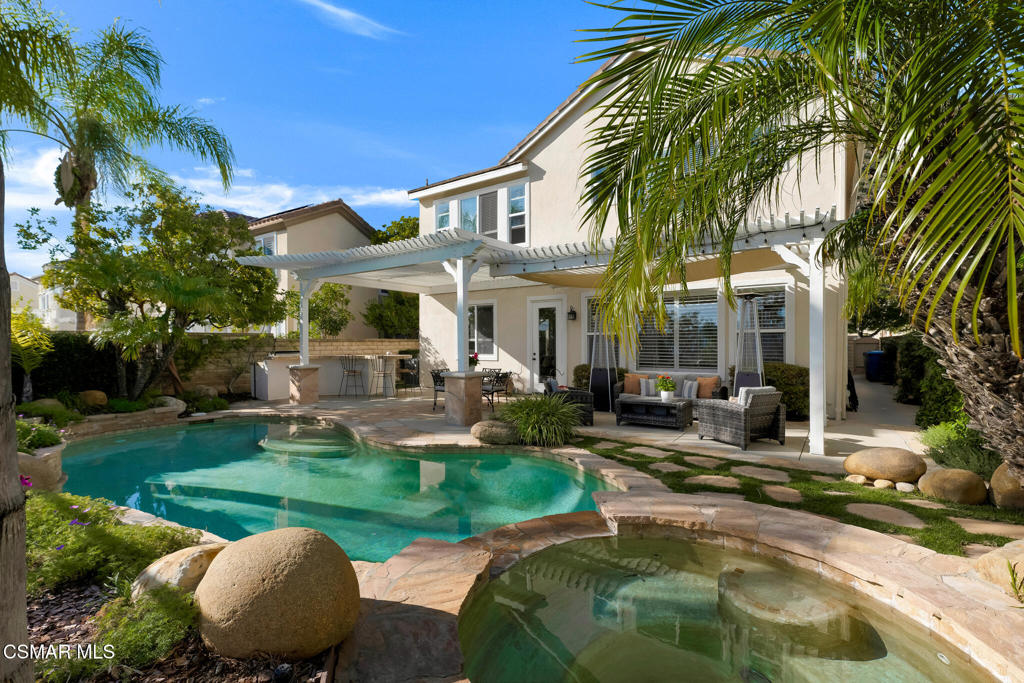 6140 Deerhill Road Oak Park, CA 91377 - Photo 37 of 72 a view of a house with backyard patio and swimming pool