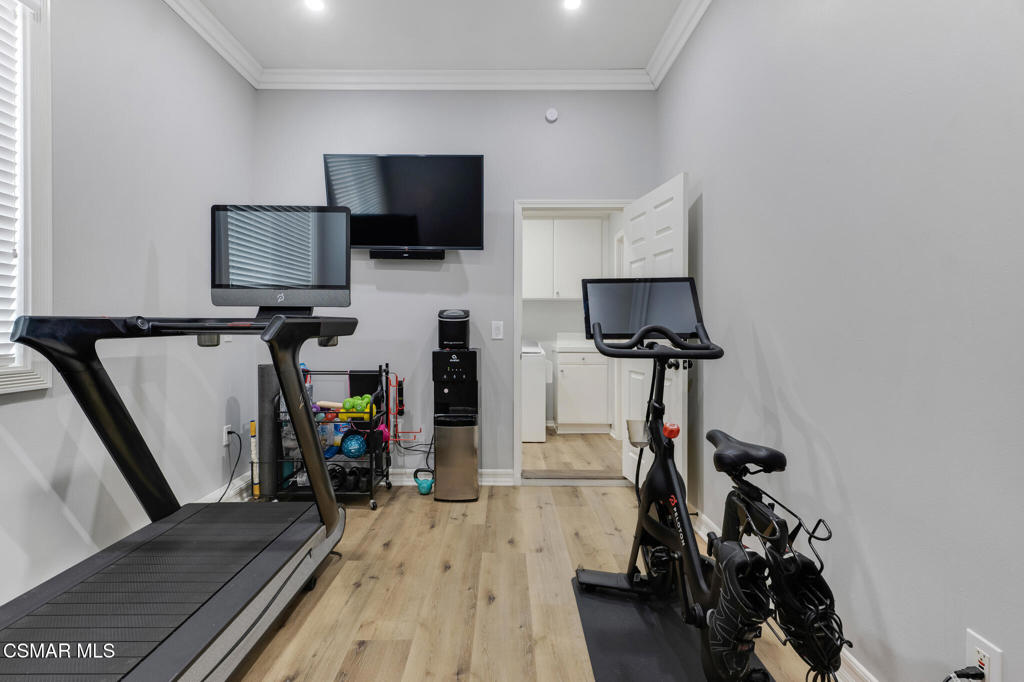6140 Deerhill Road Oak Park, CA 91377 - Photo 42 of 72 a view of a living room with furniture and a flat screen tv