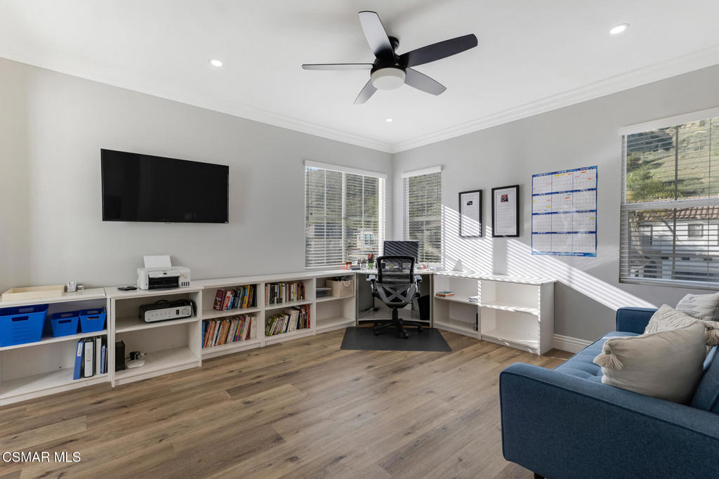 6140 Deerhill Road Oak Park, CA 91377 - Photo 47 of 72 a living room with furniture and a flat screen tv