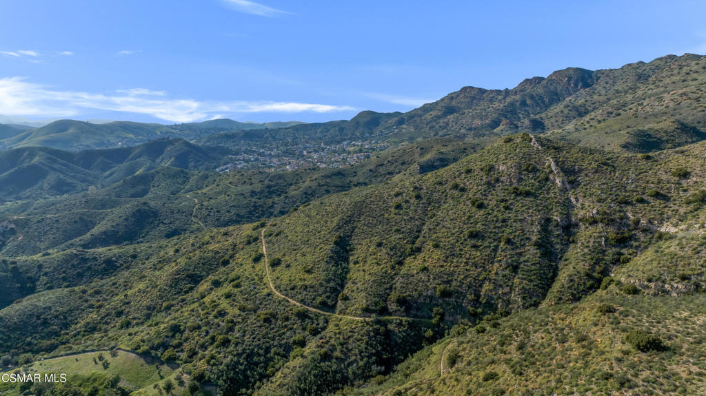 6140 Deerhill Road Oak Park, CA 91377 - Photo 53 of 72 a view of a forest with mountains in the background