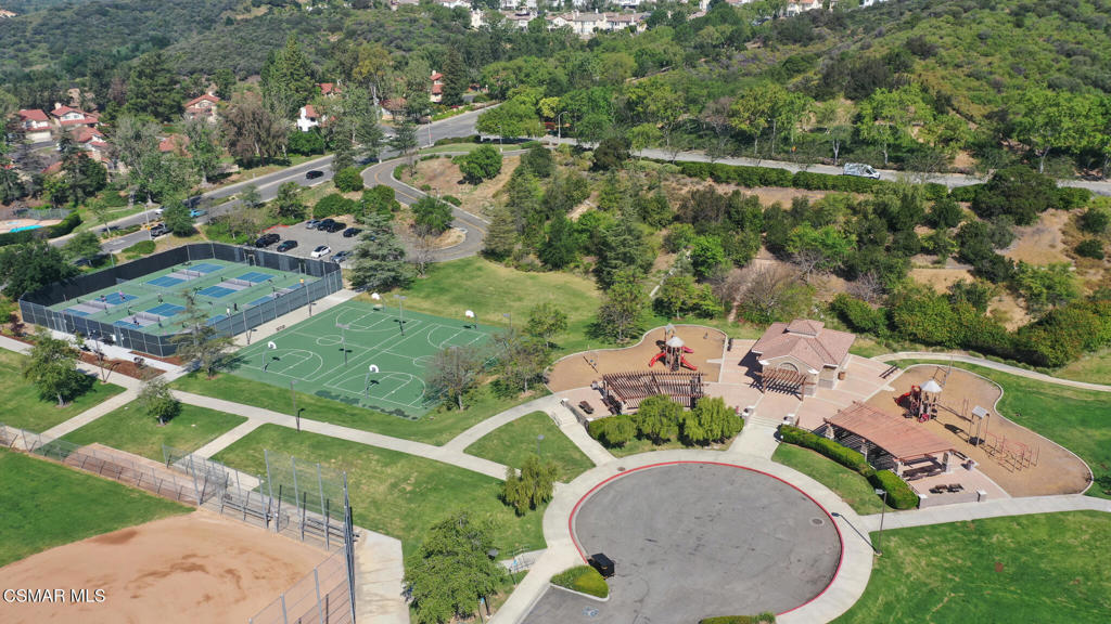 6140 Deerhill Road Oak Park, CA 91377 - Photo 60 of 72 an aerial view of a house with a yard and lake
