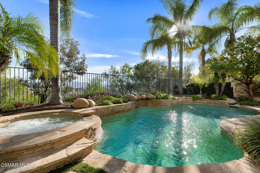6140 Deerhill Road Oak Park, CA 91377 - Photo 8 of 72 a view of backyard with swimming pool and outdoor seating
