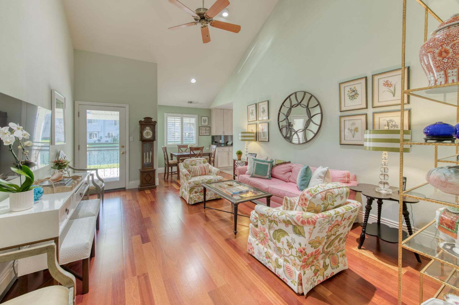 3063 West Pembrook Loop Fresno, CA 93711 - Photo 11 of 52 a living room with furniture and a clock