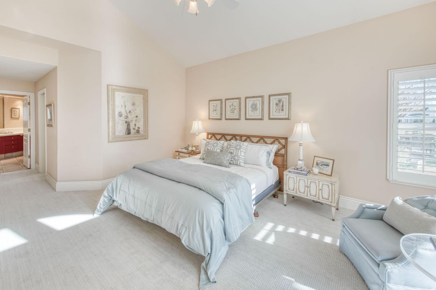 3063 West Pembrook Loop Fresno, CA 93711 - Photo 22 of 52 a bedroom with a bed and a couch