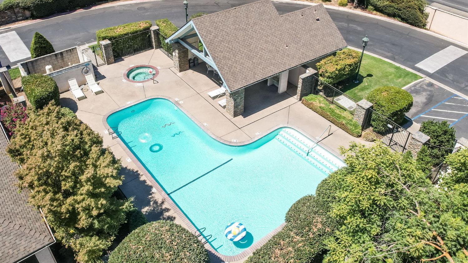 3063 West Pembrook Loop Fresno, CA 93711 - Photo 47 of 52 an aerial view of a residential houses with yard