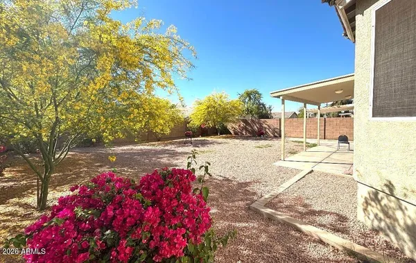 a view of yard with fountain and entertaining space