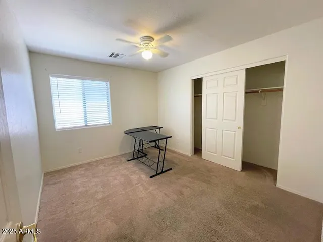 a view of a livingroom with a workspace