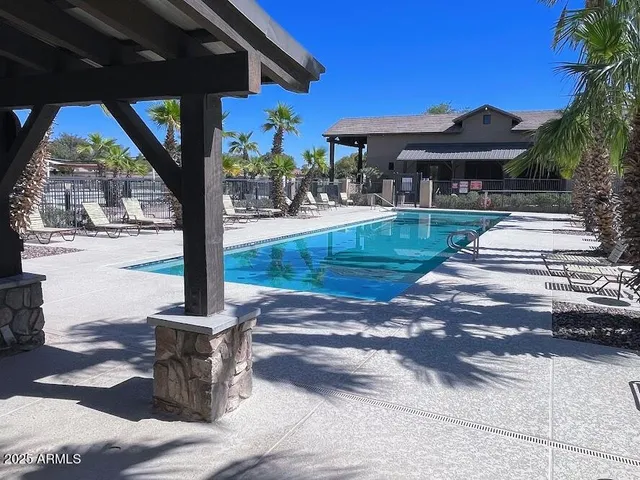 a front view of a building with trees