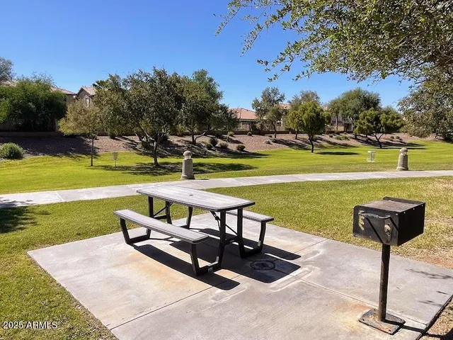 a view of a swimming pool and lounge chairs