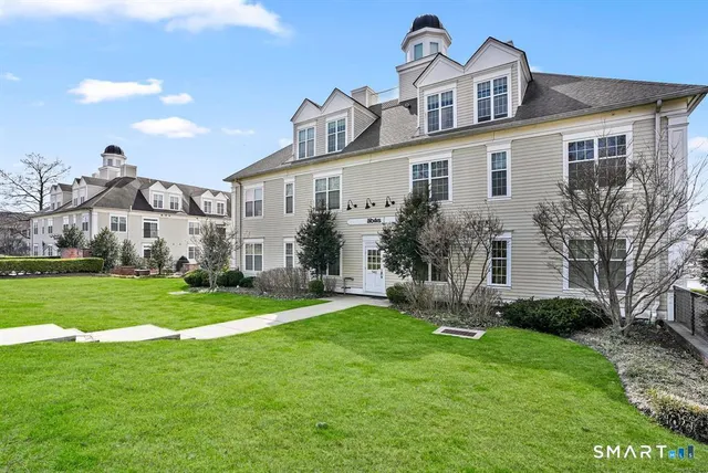 a view of a chairs and table in the patio with a garden