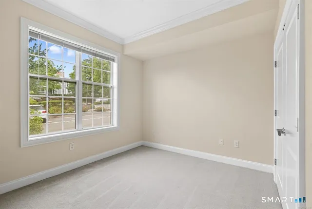 a bathroom with a granite countertop sink a toilet and a mirror