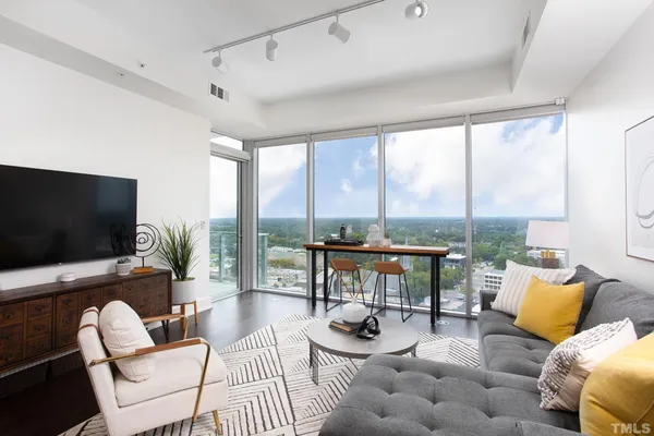 a living room with furniture and a flat screen tv
