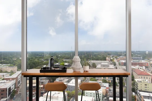 a dining room with furniture and window