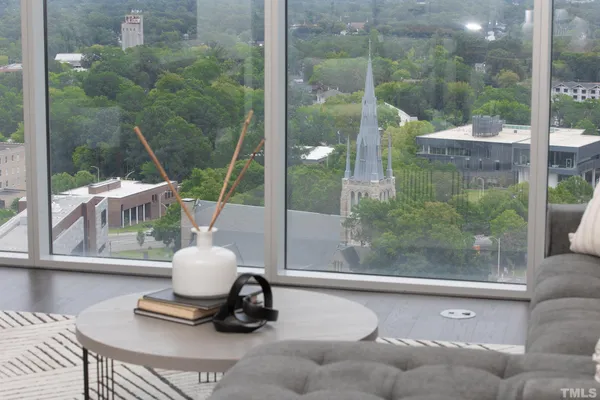 a room with pool table and windows