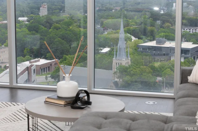 a room with pool table and windows