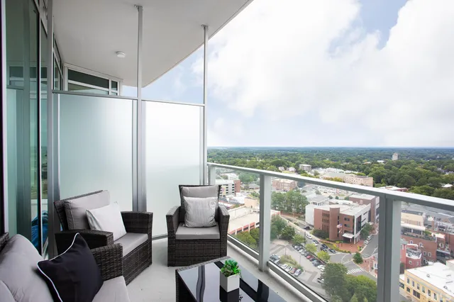 a view of a balcony with furniture