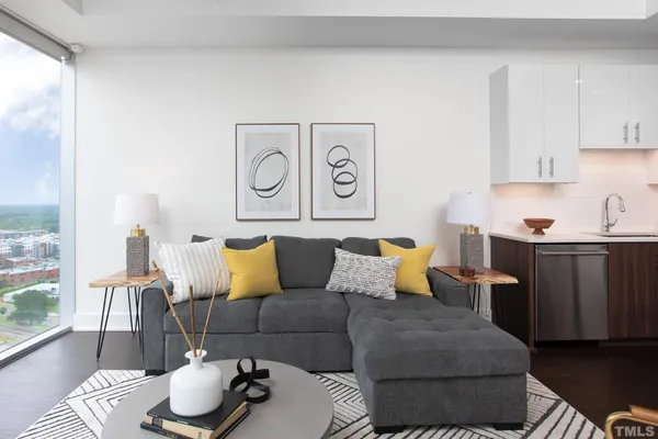 a living room with furniture and a window