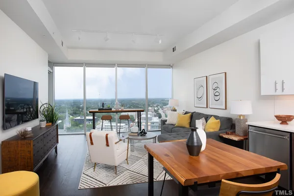 a living room with fireplace furniture and a flat screen tv