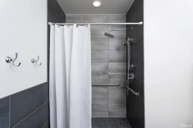 a bathroom with a glass shower door