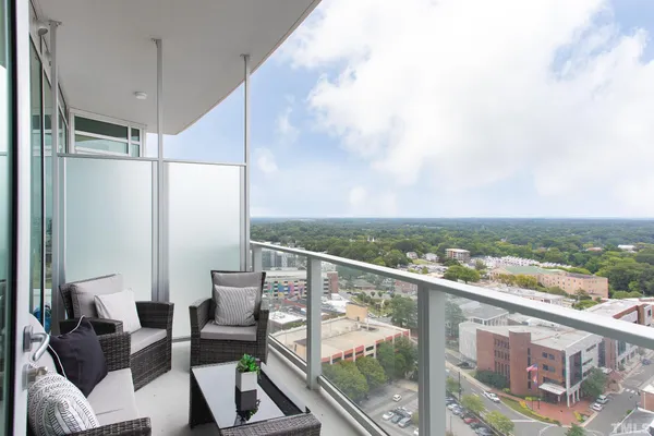 a view of a balcony with furniture