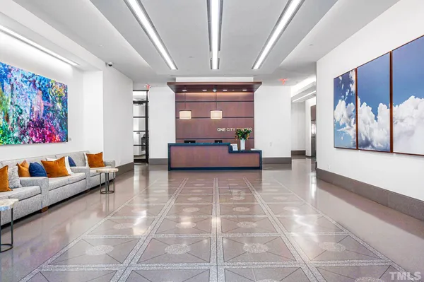 a living room with furniture and a rug