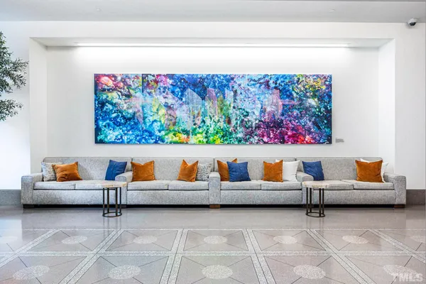 a outdoor living room with furniture and rug