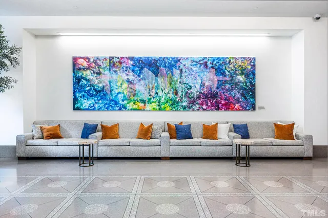 a outdoor living room with furniture and rug