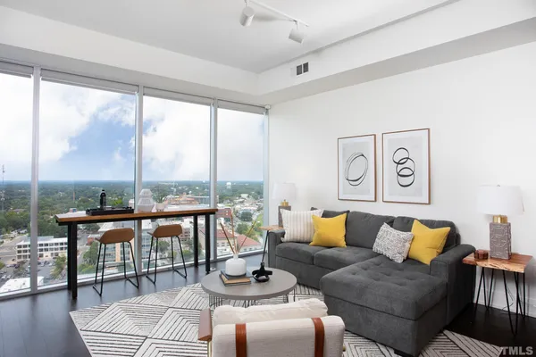 a living room with furniture and a large window