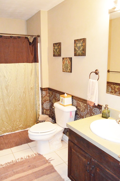 19 Birch Road Cumberland, RI 02864 - Photo 14 of 24 a bathroom with a sink and a mirror