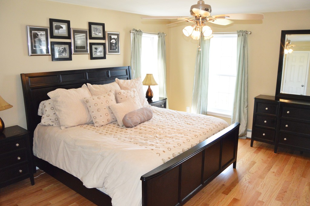 19 Birch Road Cumberland, RI 02864 - Photo 15 of 24 a bedroom with a bed and a dresser