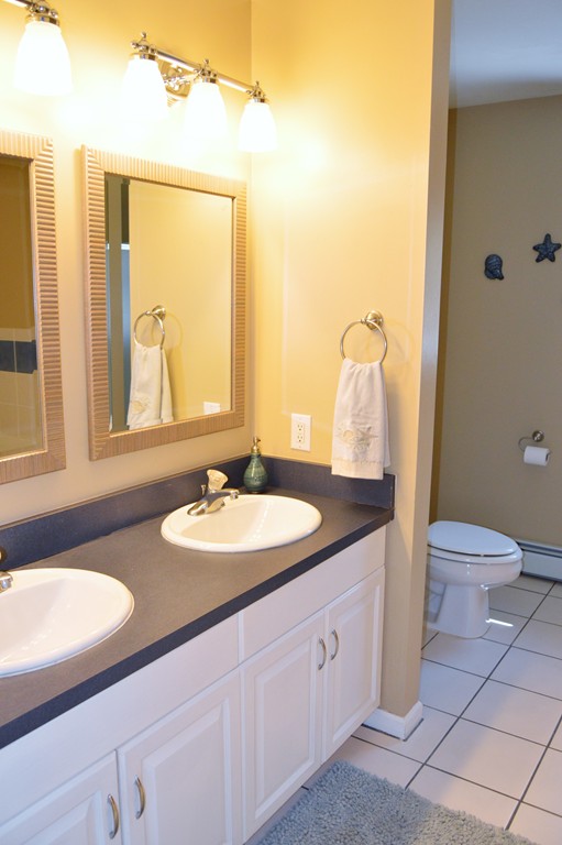 19 Birch Road Cumberland, RI 02864 - Photo 16 of 24 a bathroom with a granite countertop sink and a mirror