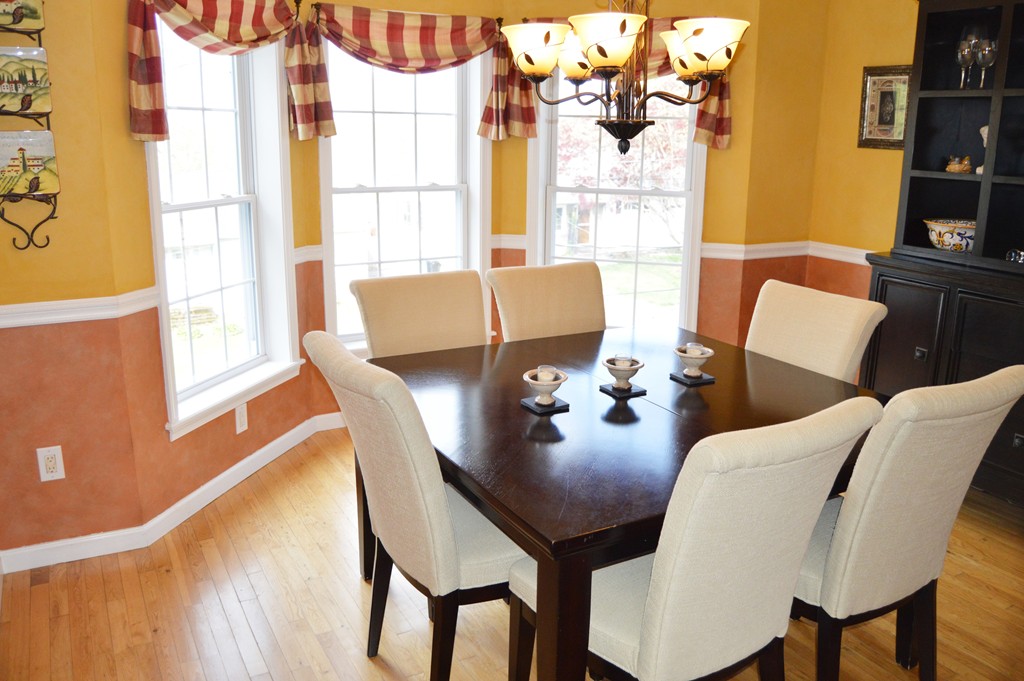 19 Birch Road Cumberland, RI 02864 - Photo 2 of 24 a view of a dining room with furniture and a window