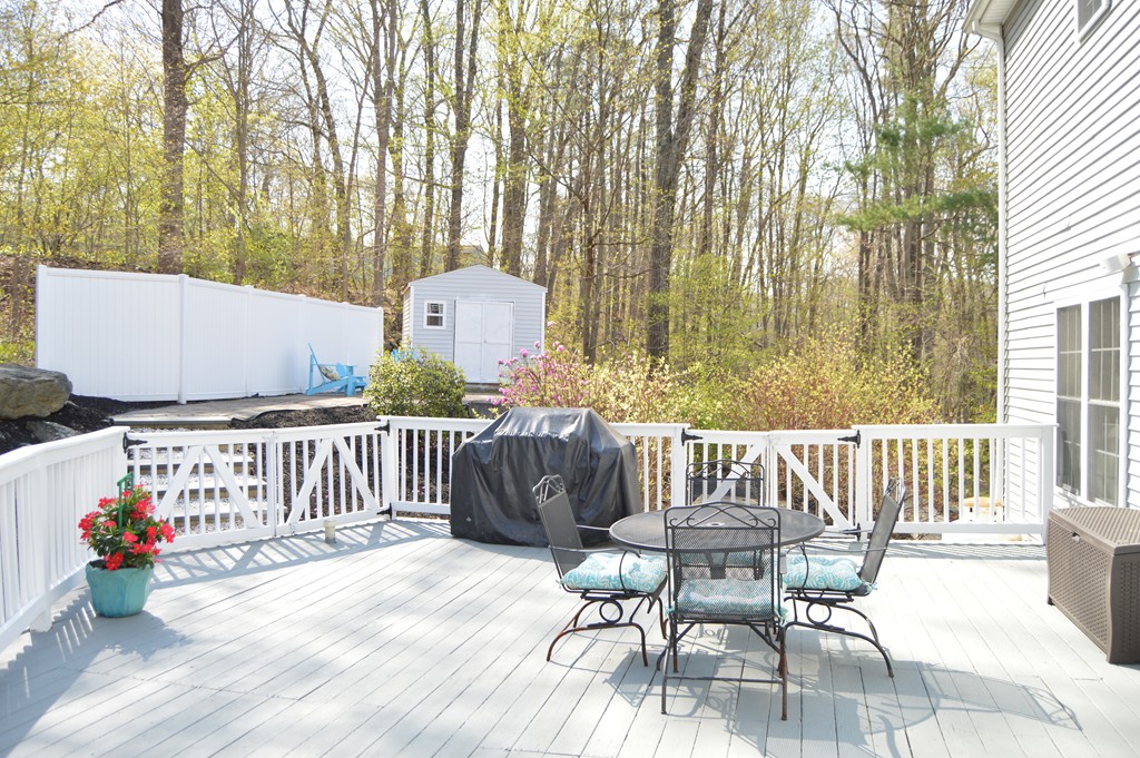 19 Birch Road Cumberland, RI 02864 - Photo 21 of 24 a view of a chairs and table on the wooden floor