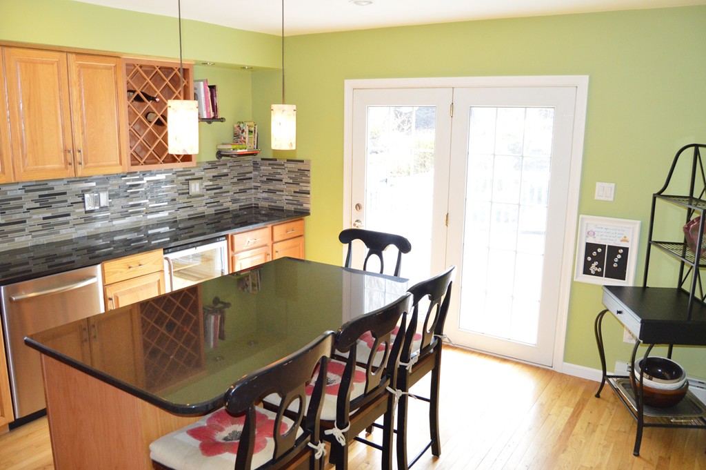 19 Birch Road Cumberland, RI 02864 - Photo 4 of 24 a view of a dining room with furniture and wooden floor