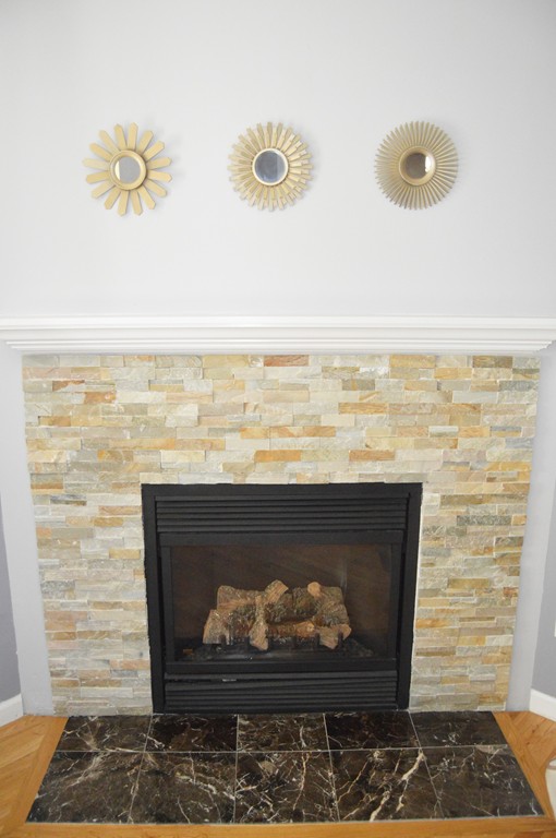 19 Birch Road Cumberland, RI 02864 - Photo 8 of 24 a room with fireplace and a rug
