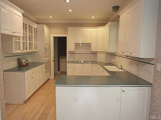 2308 Primrose Valley Court Raleigh, NC 27613 - Photo 3 of 12 The large kitchen includes solid-surface countertops, cabinets galore, and entry to the laundry/mudroom. Other