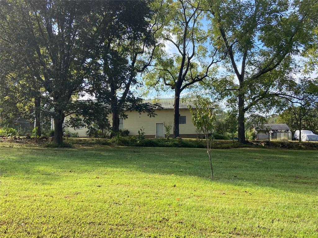 4625 Post Road Winston, GA 30187 - Photo 2 of 5 a view of a backyard with large trees
